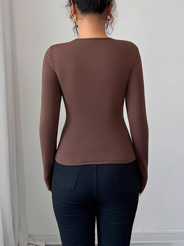 T-shirt à manches longues, coupe près du corps, à empiècements, à col asymétrique, couleur unie