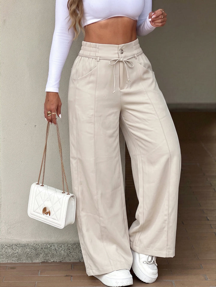 Pantalon ample à poches, à taille élastique, à jambes larges, couleur unie