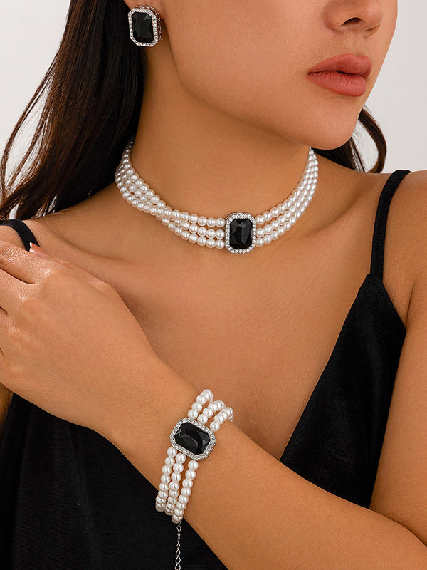 Parure bracelet, collier et boucles d'oreilles géométrique superposée à strass