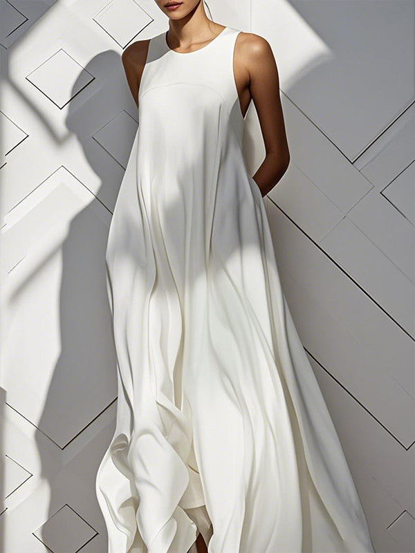 Robe longue ample sans manches, à poches, à empiècements, à col rond, couleur unie