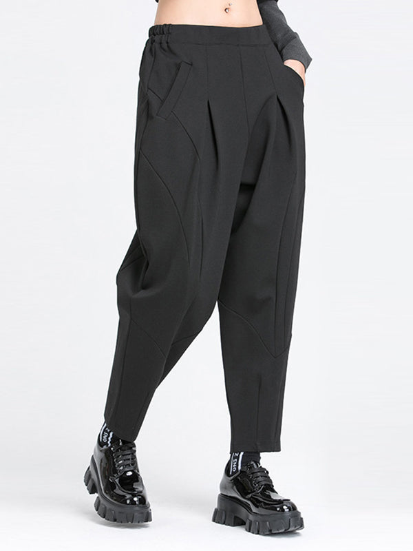 Pantalon ample plissé à taille élastique, à poches, à empiècements, couleur unie