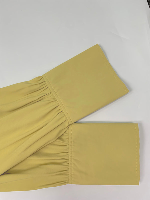 Robe longue boutonnée plissée coupe trapèze, à manches longues, à poches, à taille nouée, à col en V, couleur unie