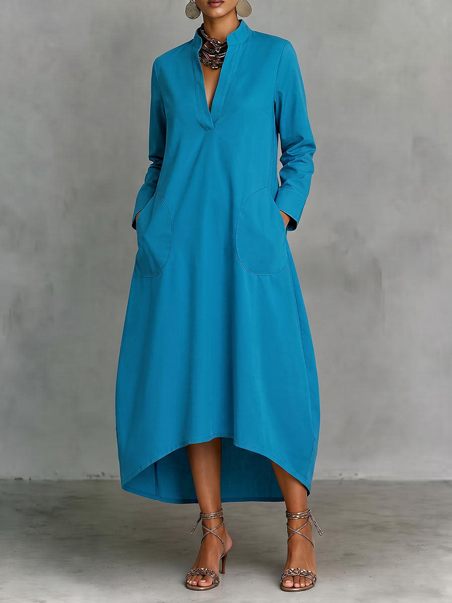 Robe mi-longue ample à poches, à manches longues, à col en V, couleur unie