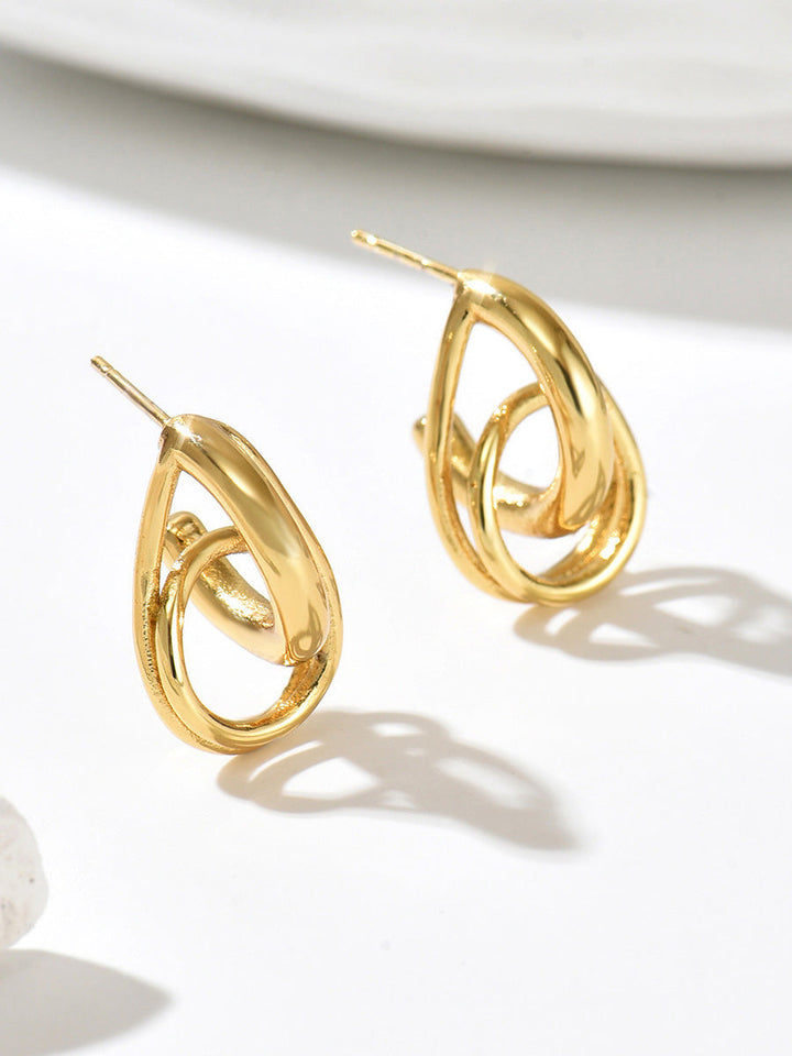 Boucles d'oreilles pendantes géométriques ajourées en forme de goutte