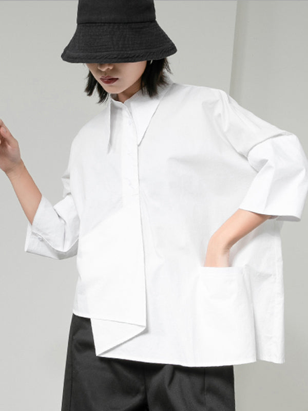 Blouse unie à coupe irrégulière et col revers