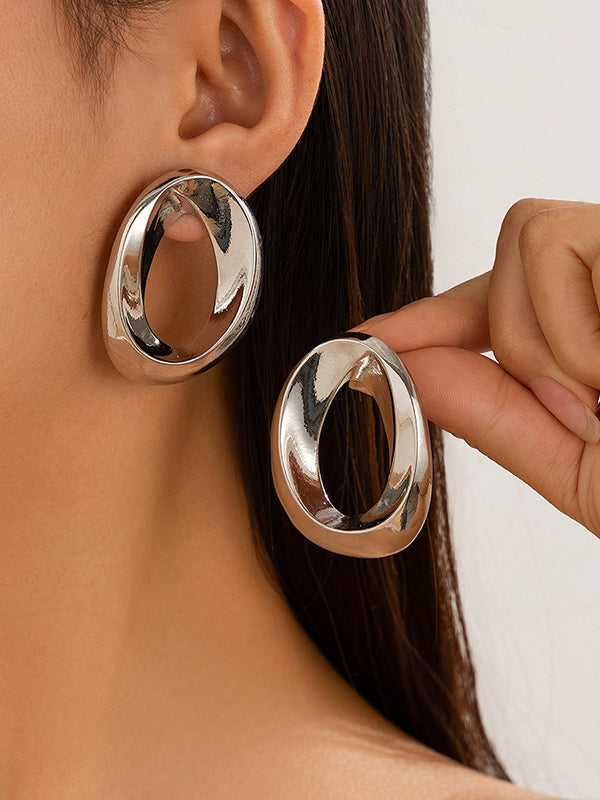 Boucles d'oreilles asymétriques brillantes couleur unie