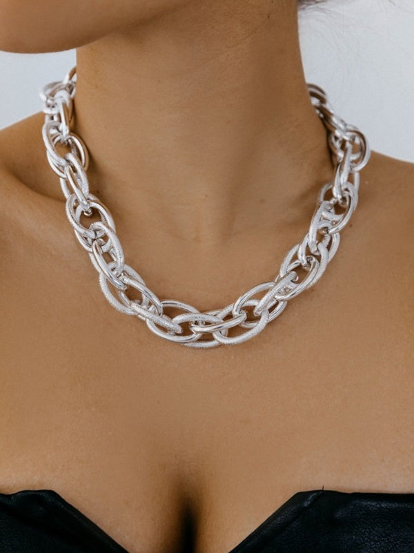 Parure collier et bracelet ajourée couleur unie