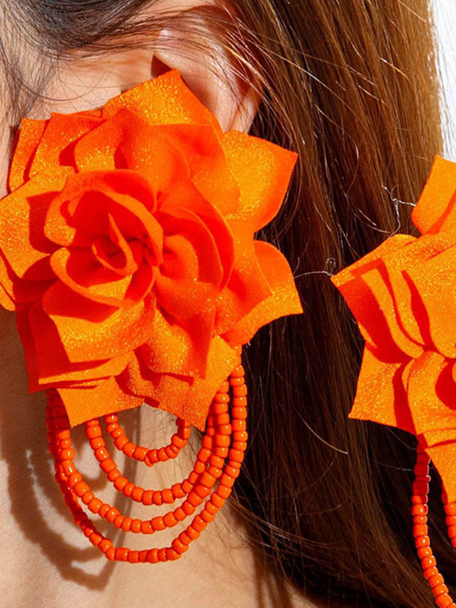 Boucles d'oreilles pendantes en forme de fleur, à pompons