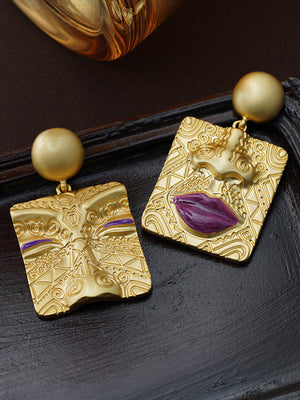 Boucles d'oreilles asymétriques gaufrées