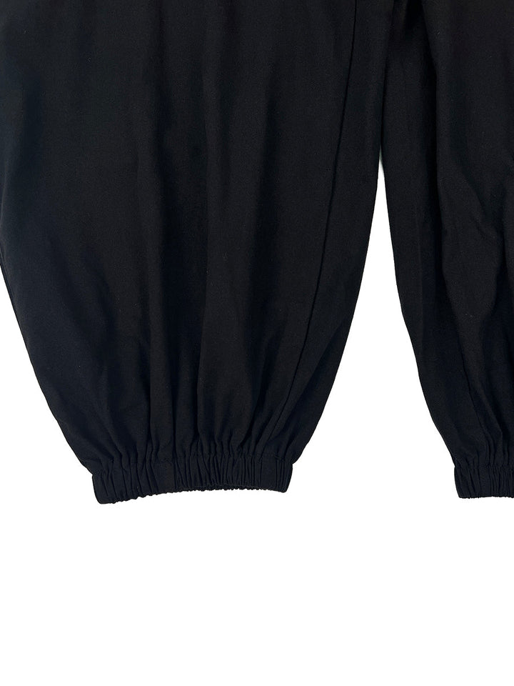 Combinaison boutonnée sans manches, à jambes larges, à col en V, couleur unie