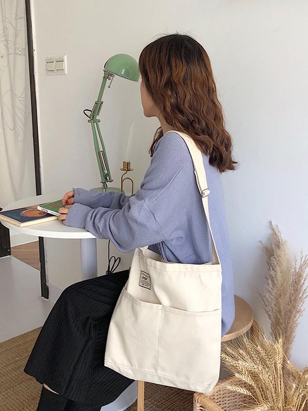 Sac à main simple en toile de couleur unie avec poches