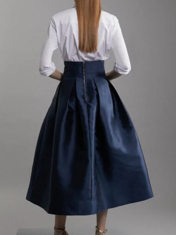 Jupe plissée coupe trapèze, taille haute, à fermeture éclair, couleur unie