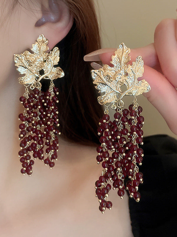Boucles d'oreilles pendantes géométriques en forme de feuilles, à pompons