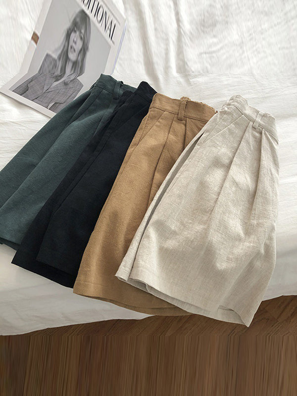 Short ample plissé à jambes larges, à taille élastique, couleur unie