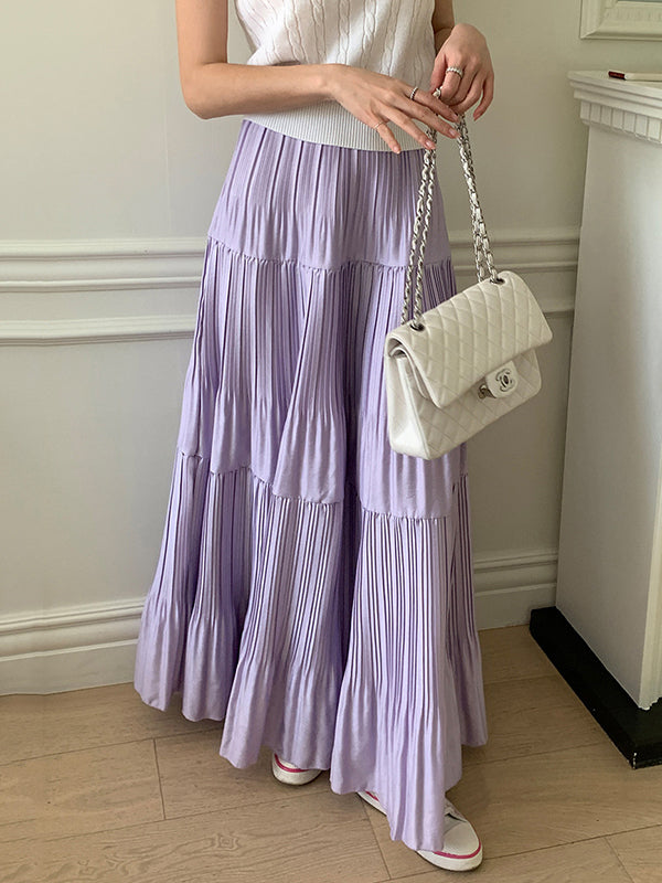 Jupe plissée coupe trapèze, taille haute, à empiècements, couleur unie