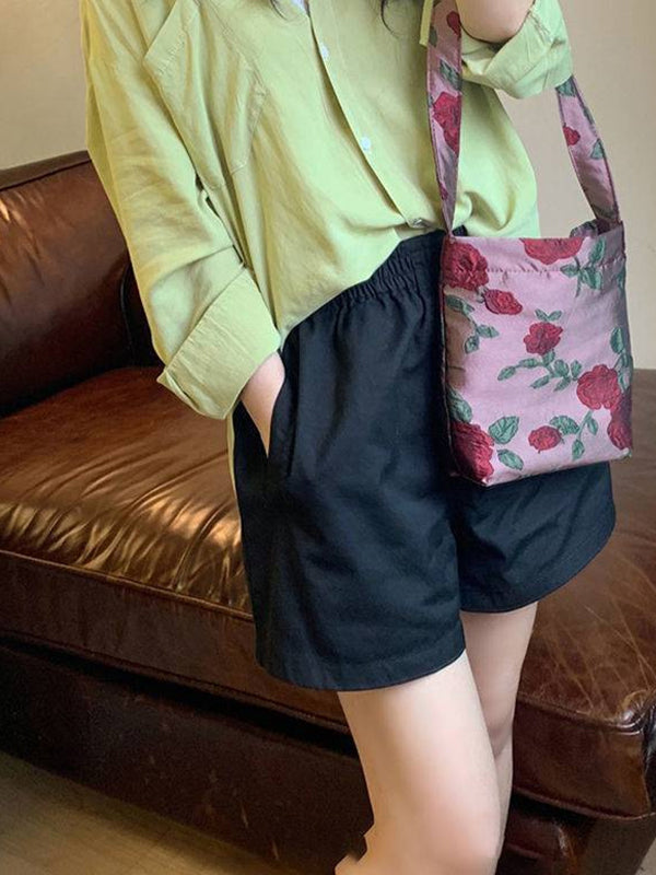 Short ample taille haute, à taille élastique, à empiècements, couleur unie