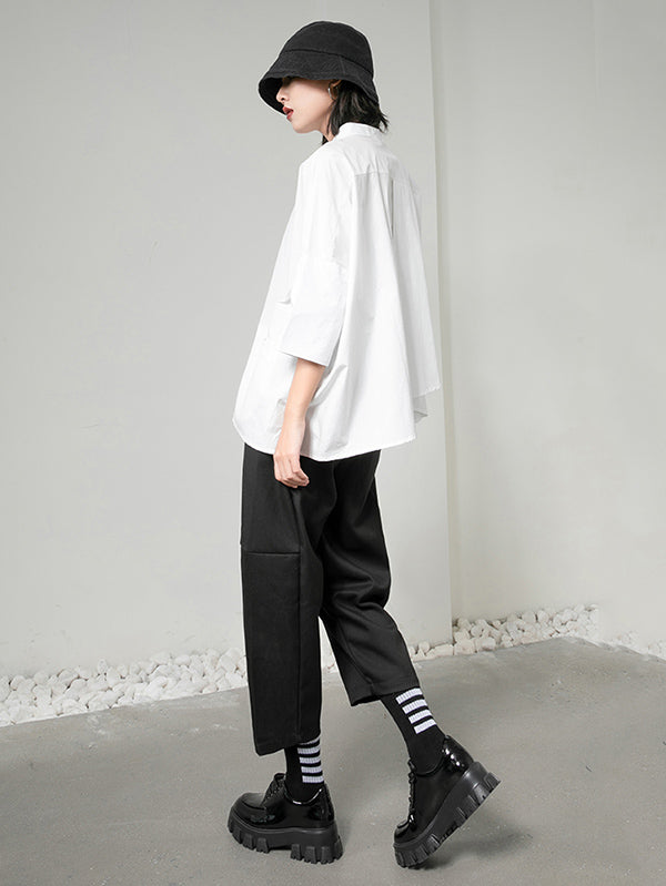 Blouse unie à coupe irrégulière et col revers