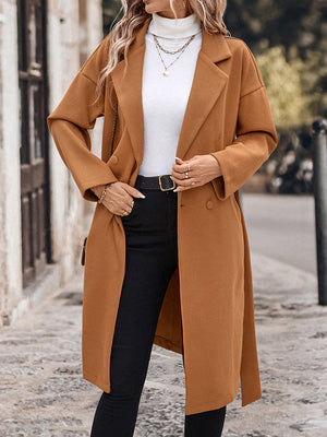 Manteau en laine ample boutonné à manches longues, à empiècements, à taille nouée, à col cranté, couleur unie