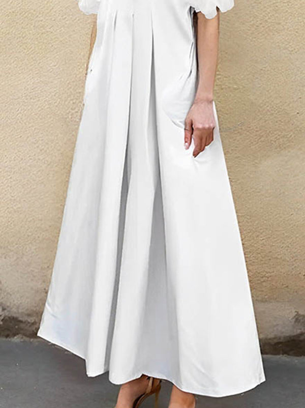 Robe chemise ample plissée coupe trapèze, à empiècements, à col revers, couleur unie