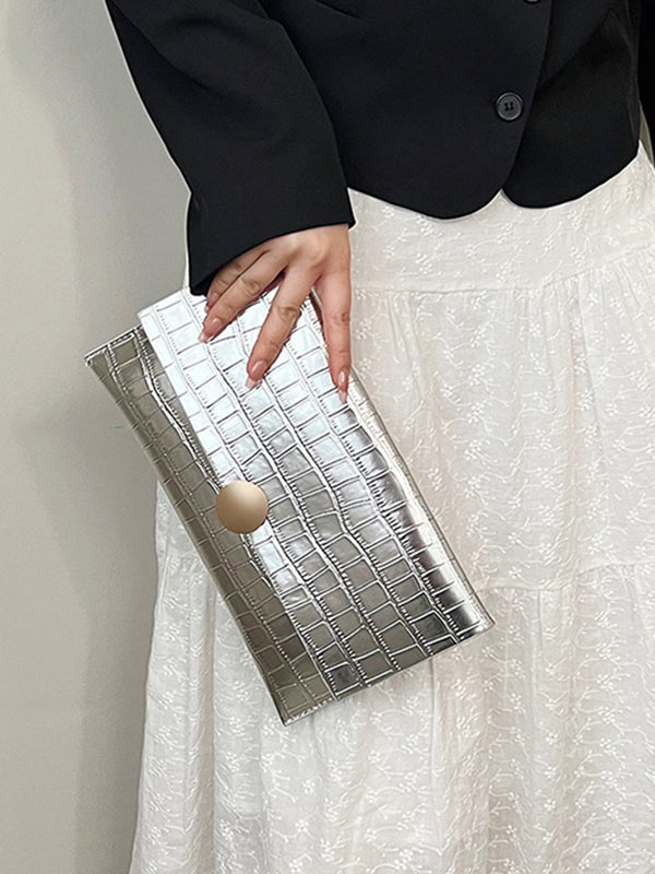 Sac à main géométrique brillant à empiècements