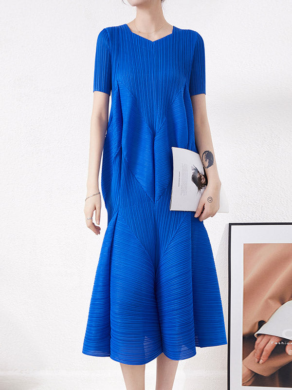 Robe mi-longue ample plissée taille haute, à col rond, couleur unie