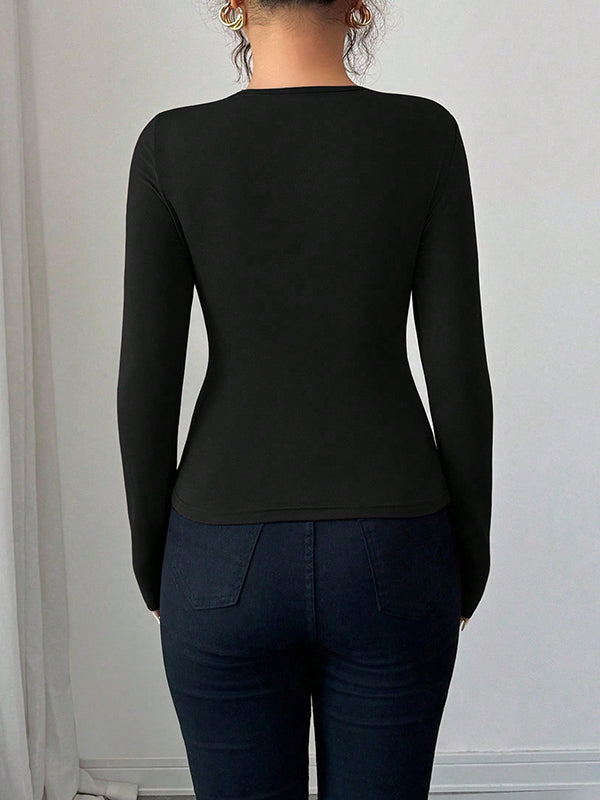 T-shirt à manches longues, coupe près du corps, à empiècements, à col asymétrique, couleur unie