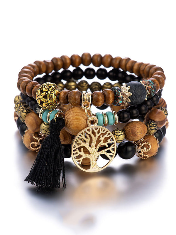 Bracelet bohémien multicouche en perles de bois fait à la main avec pompons
