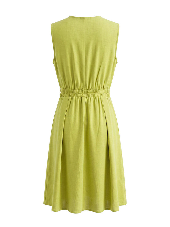 Robe courte plissée coupe trapèze, sans manches, à poches, à fermeture éclair, à col rond, couleur unie