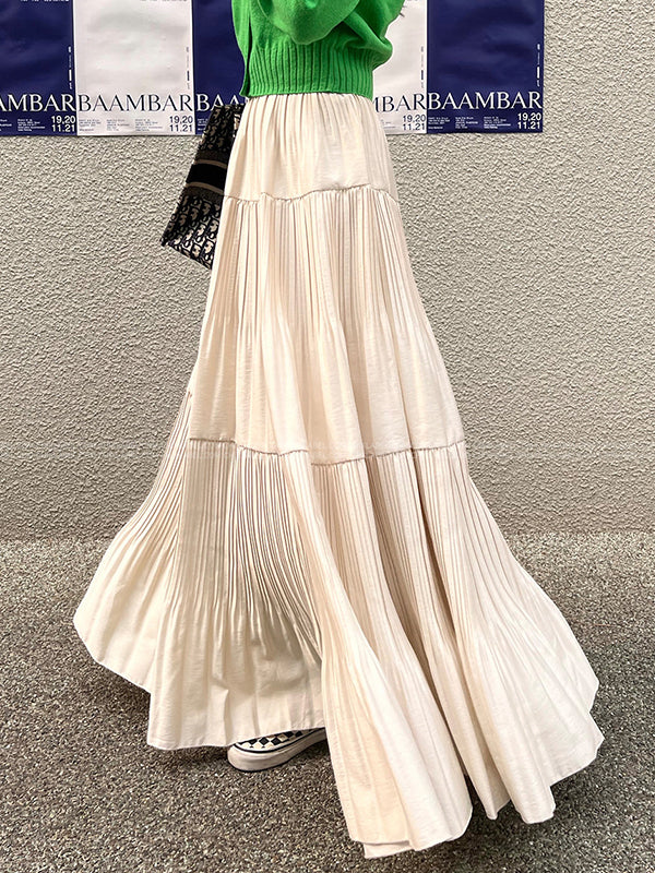 Jupe plissée coupe trapèze, taille haute, à empiècements, couleur unie