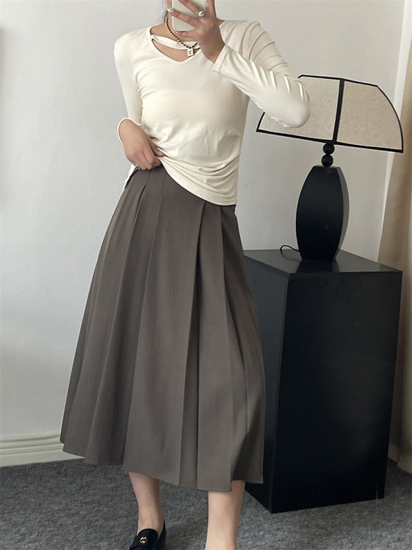 Jupe plissée coupe trapèze, taille haute, à empiècements, couleur unie