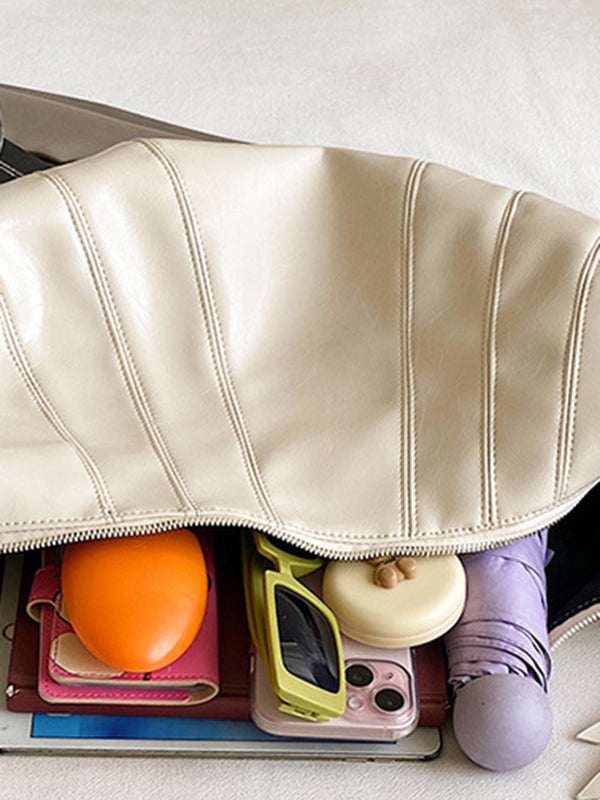 Sac bandoulière géométrique à empiècements, à fermeture éclair