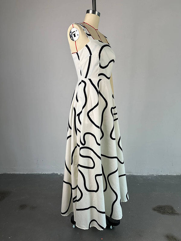 Robe longue imprimée coupe trapèze, taille haute, à poches, à empiècements, à fines bretelles