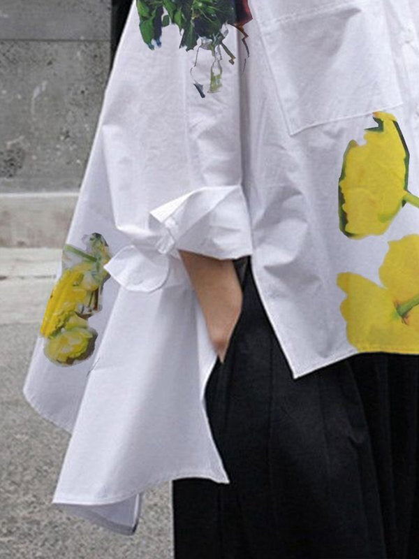Chemisier boutonné fendu sur le côté à ourlet plongeant, à manches longues, à imprimé floral, à poches, à col montant