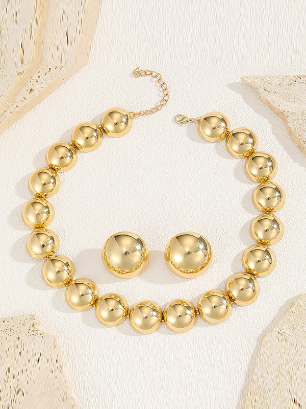 Parure collier et boucles d'oreilles perlée à empiècements, couleur unie