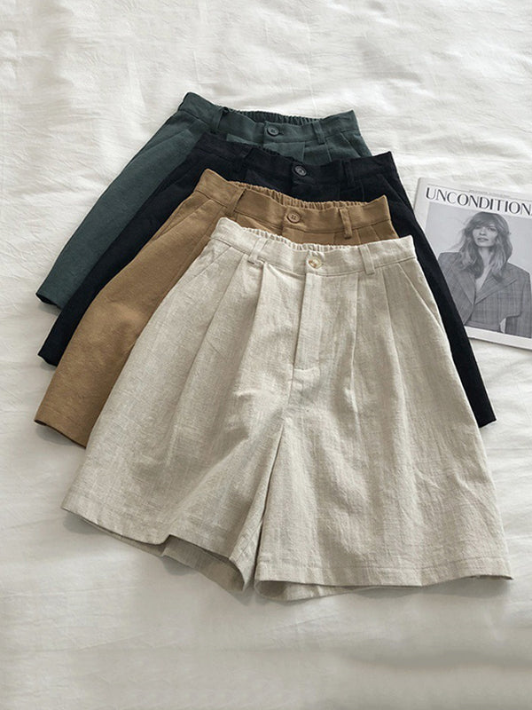 Short ample plissé à jambes larges, à taille élastique, couleur unie