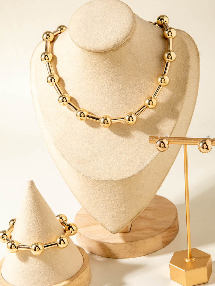 Parure collier et boucles d'oreilles géométrique couleur unie