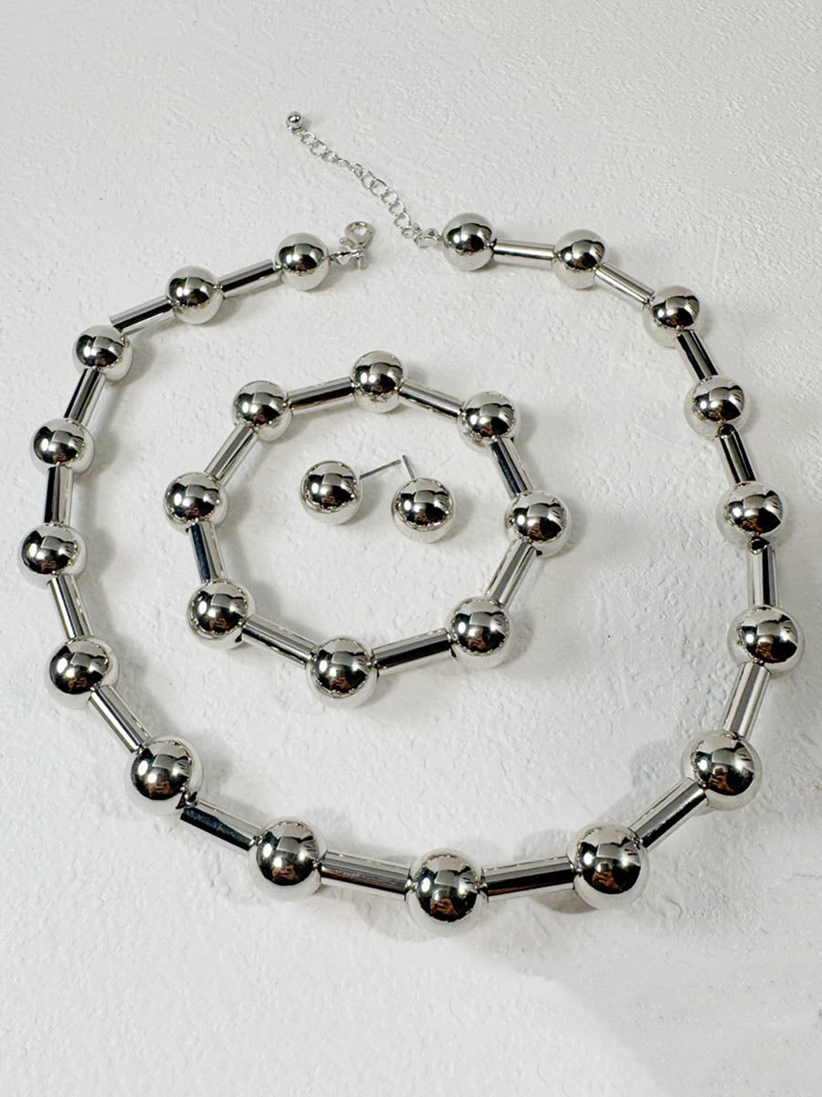 Parure collier et boucles d'oreilles géométrique couleur unie