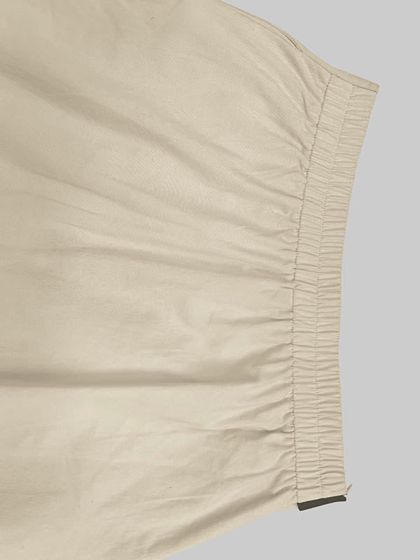 Jupe ample asymétrique coupe trapèze, à taille élastique, à poches, à empiècements
