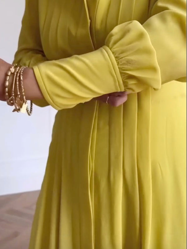 Robe longue boutonnée plissée coupe trapèze, à manches longues, à poches, à taille nouée, à col en V, couleur unie
