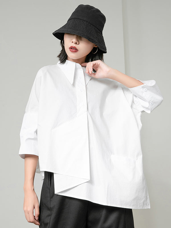 Blouse unie à coupe irrégulière et col revers
