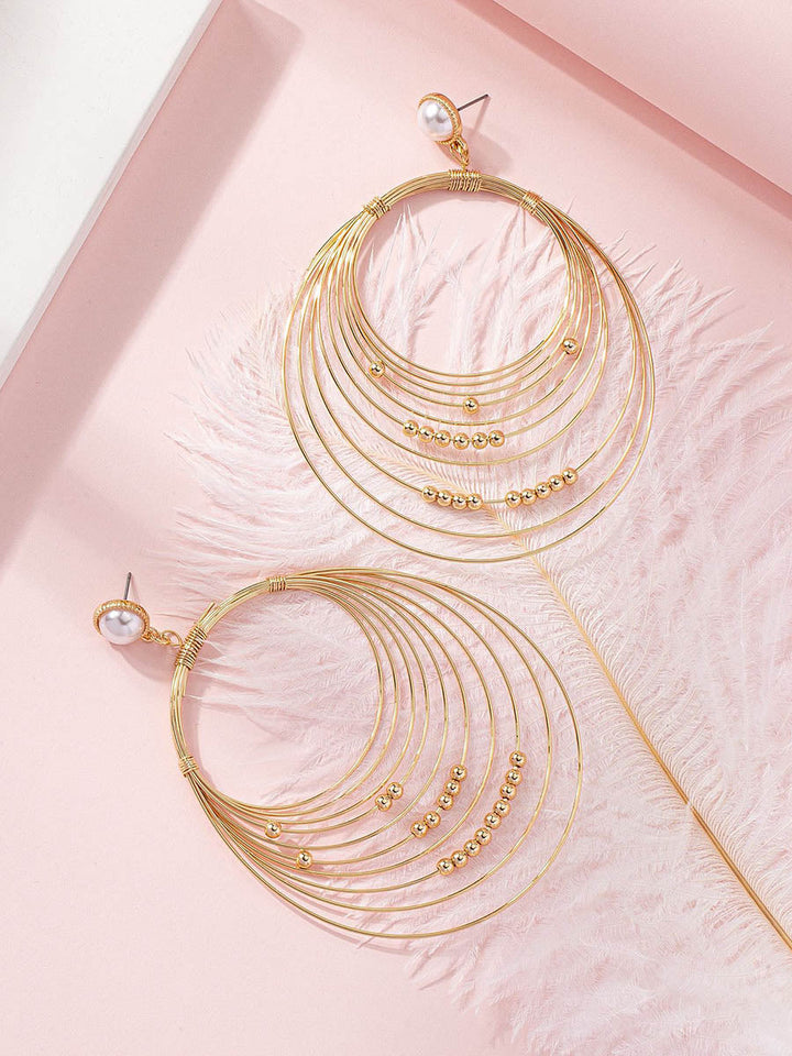 Boucles d'oreilles géométriques à coupe irrégulière