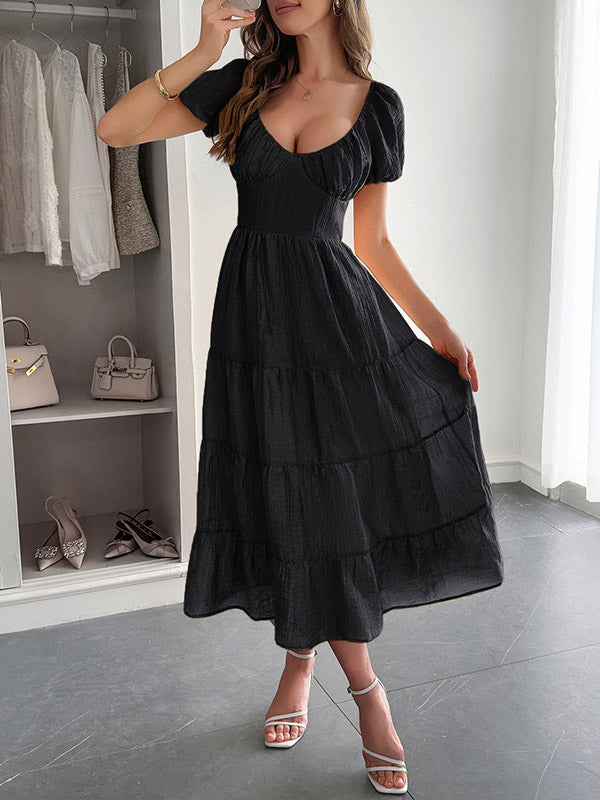 Robe mi-longue ample plissée nouée coupe trapèze, dos nu, à col en V, couleur unie