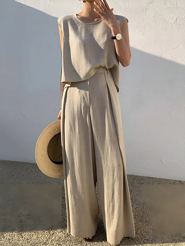Pantalon ample plissé taille haute, à empiècements, couleur unie