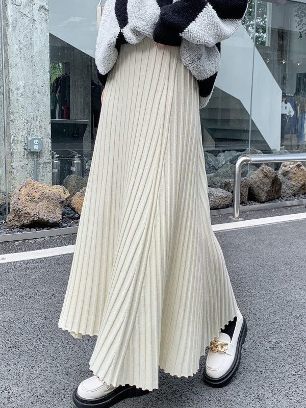 Jupe plissée coupe trapèze, taille haute, couleur unie