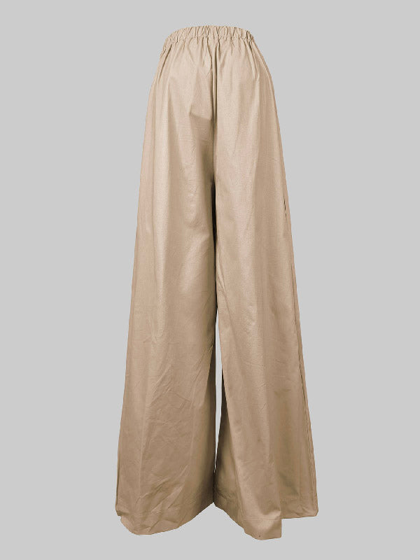 Pantalon ample plissé taille haute, à empiècements, couleur unie