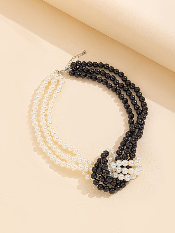 Collier perlé à empiècements