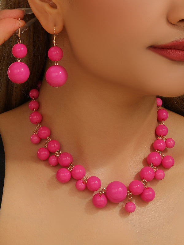 Parure collier et boucles d'oreilles à empiècements