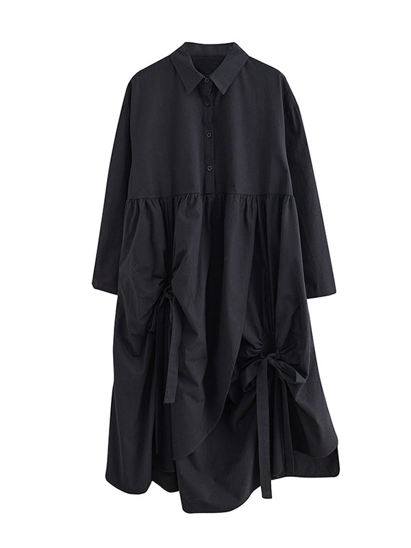 Robe chemise boutonnée plissée nouée coupe trapèze, à manches longues, à poches, à col revers, couleur unie
