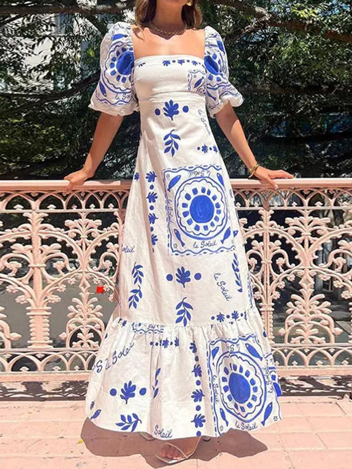Robe mi-longue plissée imprimée volantée coupe trapèze, taille haute, à empiècements, à col carré, couleur contrastée