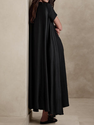 Robe longue ample à manches courtes, à poches, à col rond, couleur unie